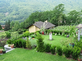 round garden and stone pergola with grill